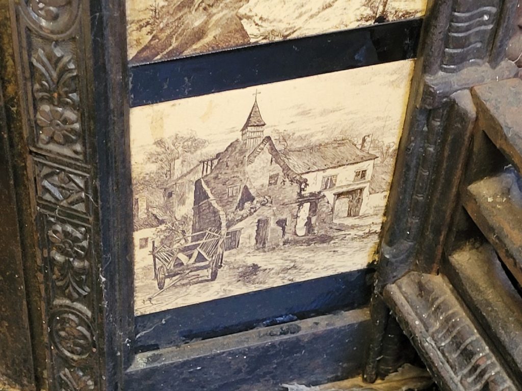 ceramic fireplace decorative insert with painted image - appears to be an old Scottish church