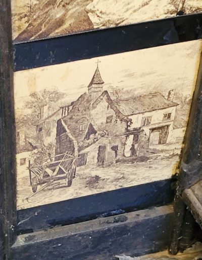 ceramic fireplace decorative insert with painted image - appears to be an old Scottish church