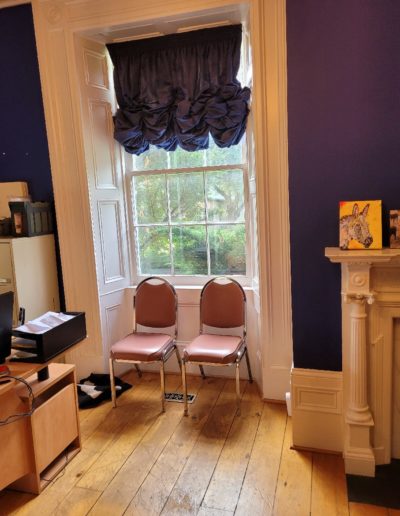 19th century farmhouse living room window with original blown glass