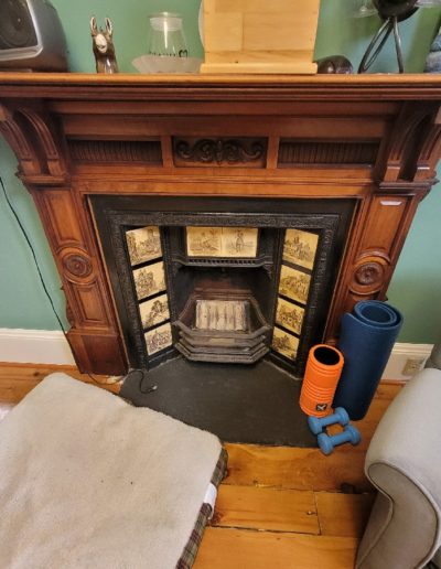 19th century wrought iron fireplace with artistic ceramic inserts