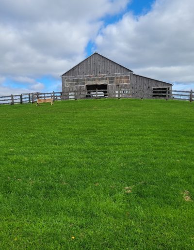 small barn on a hill