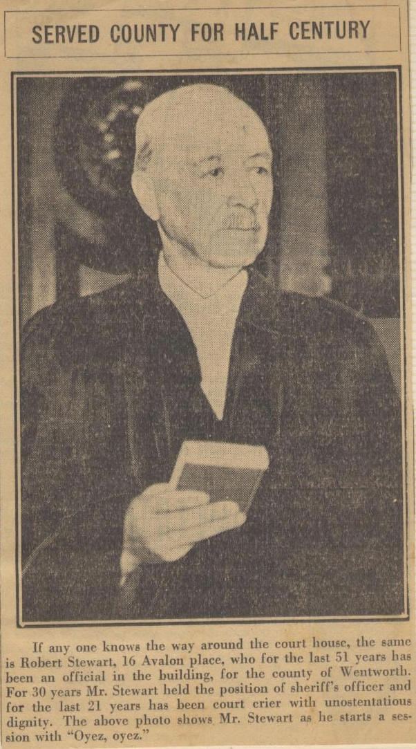 newspaper clipping of older, balding man in judicial robes